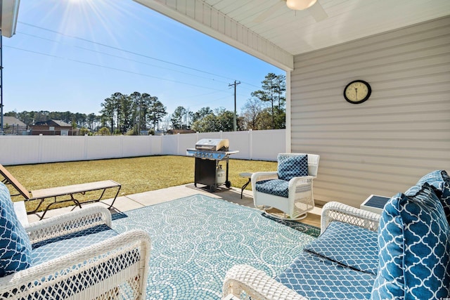 view of patio / terrace featuring area for grilling and ceiling fan