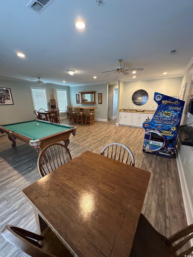 playroom with hardwood / wood-style flooring, ceiling fan, crown molding, and pool table