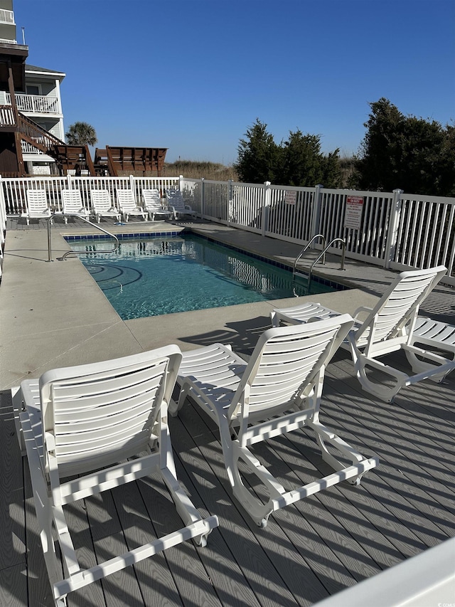 view of swimming pool with a patio