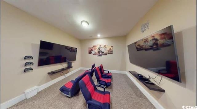 rec room with carpet and baseboards