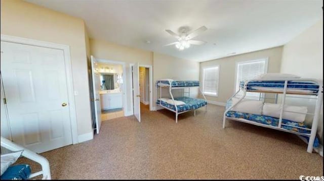 carpeted bedroom with lofted ceiling, ceiling fan, and baseboards