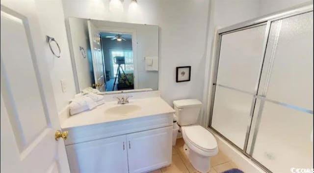 full bath with toilet, a stall shower, and vanity