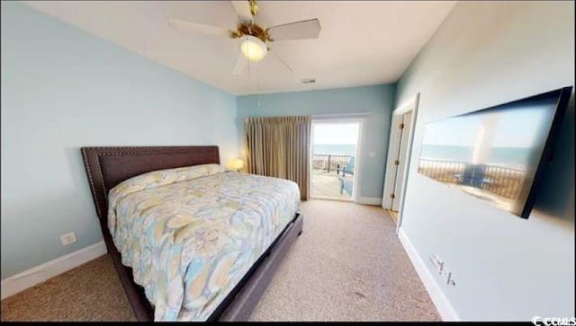 bedroom featuring access to exterior, baseboards, a ceiling fan, and light colored carpet