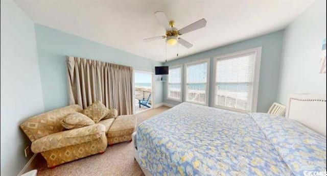 bedroom featuring light carpet, baseboards, and a ceiling fan