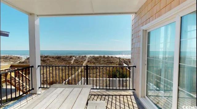 balcony featuring a water view
