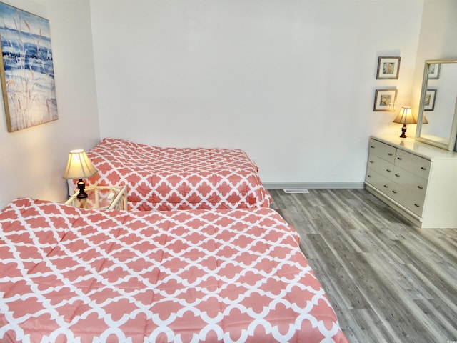 bedroom featuring hardwood / wood-style floors