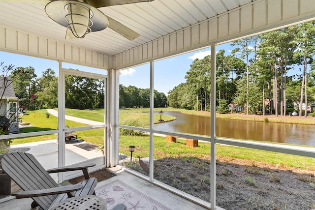 unfurnished sunroom featuring a healthy amount of sunlight and a water view