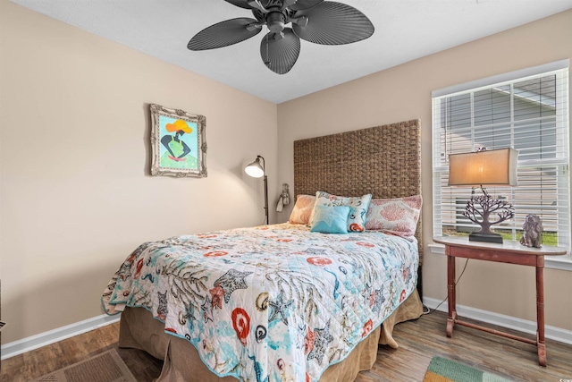 bedroom featuring wood-type flooring and ceiling fan