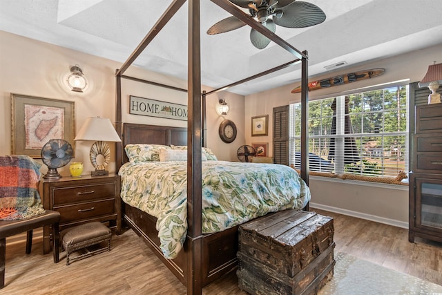 bedroom with wood-type flooring