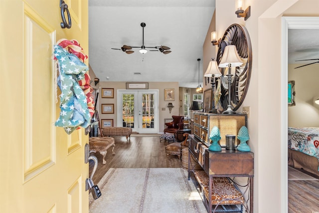 entrance foyer with hardwood / wood-style floors, vaulted ceiling, french doors, and ceiling fan