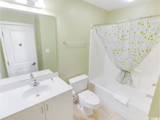 bathroom featuring vanity, tile patterned flooring, toilet, and shower / tub combo with curtain