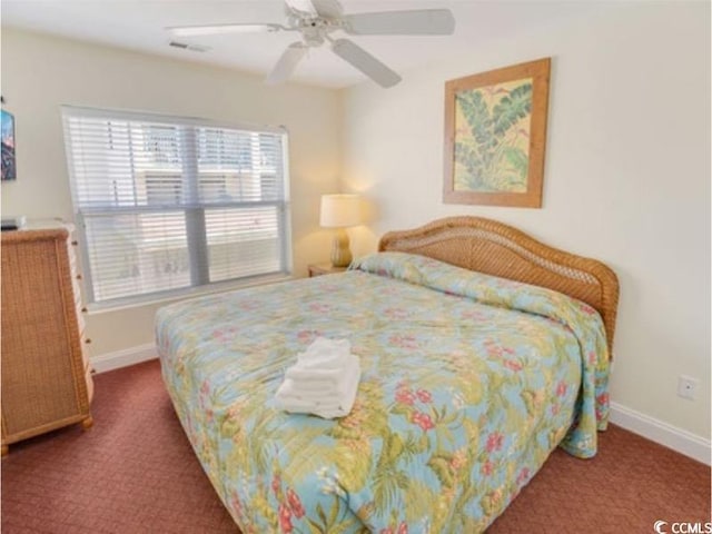 bedroom with carpet floors, visible vents, ceiling fan, and baseboards