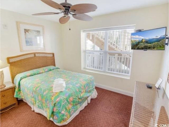 bedroom with carpet, ceiling fan, and baseboards