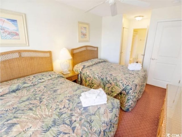 carpeted bedroom featuring ceiling fan