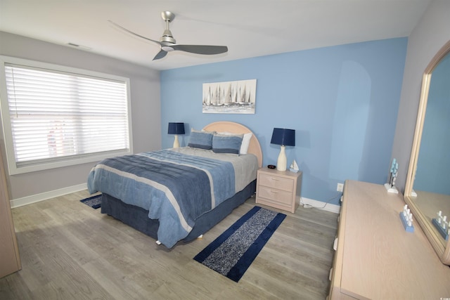 bedroom featuring light hardwood / wood-style floors and ceiling fan