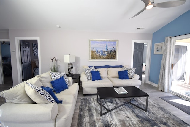 living room with hardwood / wood-style floors and ceiling fan