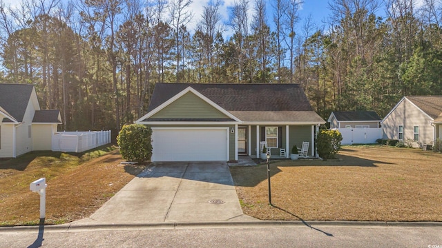 view of front of house featuring a front yard and a garage