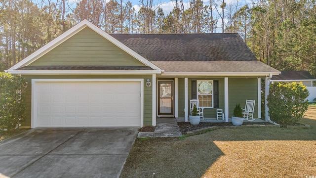 view of front of house featuring a garage and a front lawn