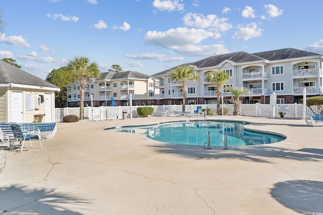 view of swimming pool with a patio area