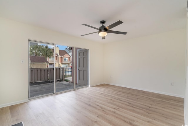 unfurnished room with light wood-type flooring and ceiling fan