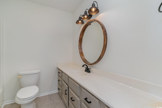 bathroom featuring tile patterned floors, vanity, and toilet