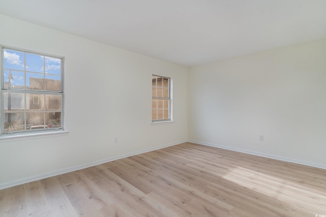 spare room featuring light hardwood / wood-style flooring