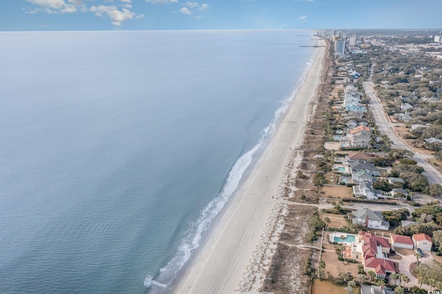 drone / aerial view with a view of the beach and a water view