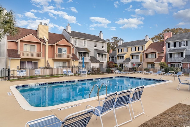 view of swimming pool with a patio area