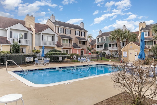 view of swimming pool with a patio