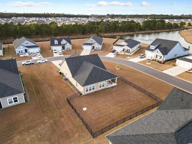 aerial view with a residential view and a water view