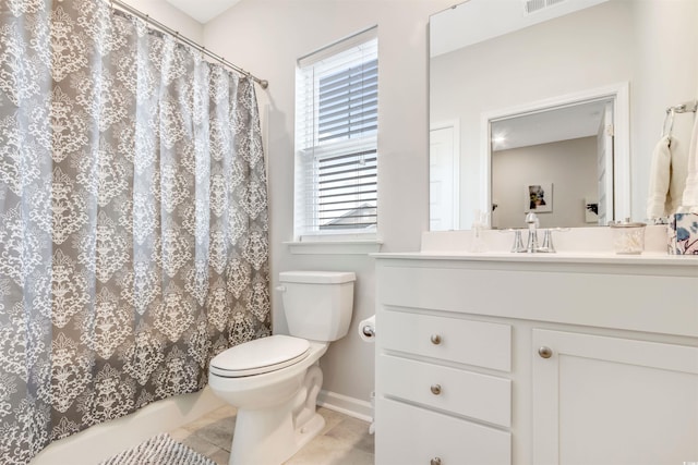 bathroom featuring a wealth of natural light, visible vents, toilet, and vanity