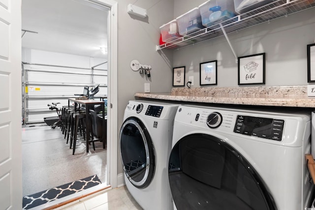 clothes washing area with washer and dryer