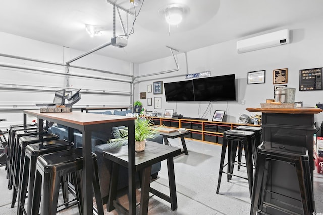 garage featuring a garage door opener and an AC wall unit