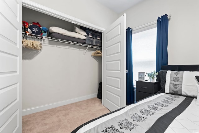 bedroom featuring light carpet