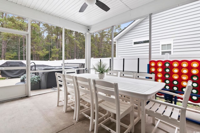 sunroom featuring ceiling fan