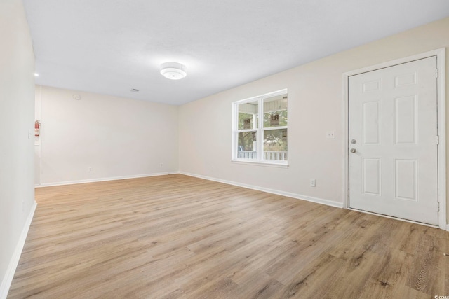 spare room with light wood-type flooring