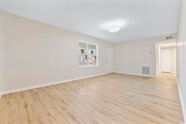 unfurnished room featuring light hardwood / wood-style floors