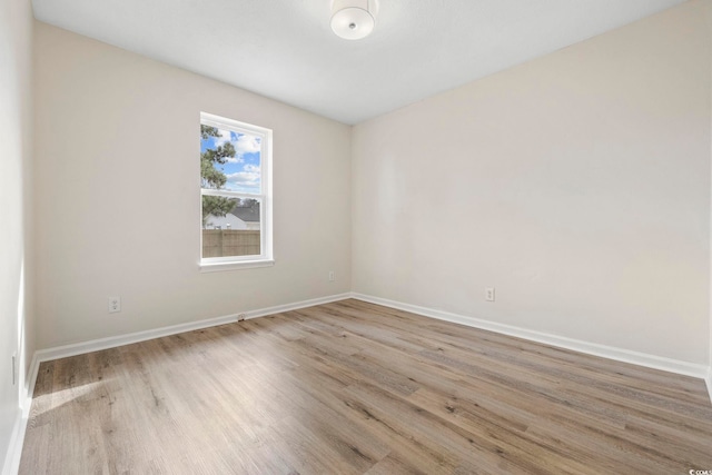 spare room featuring light hardwood / wood-style floors