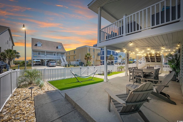 view of patio terrace at dusk