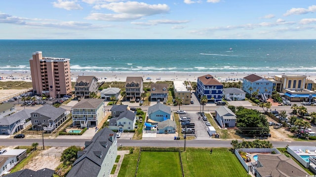 bird's eye view featuring a water view and a view of the beach