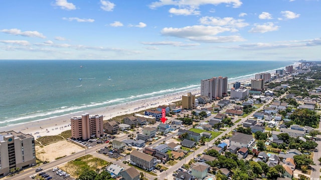 bird's eye view with a water view and a view of the beach