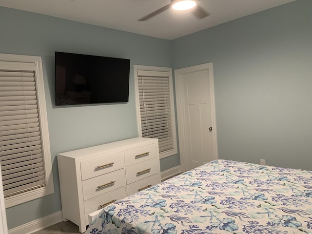 bedroom with baseboards and ceiling fan