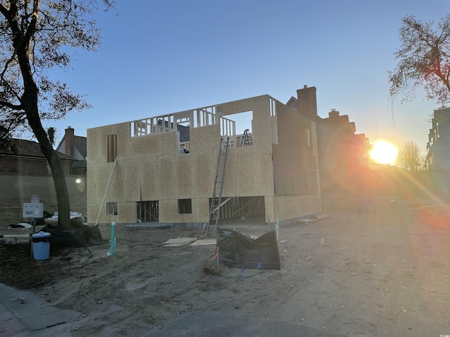 back of property featuring stucco siding