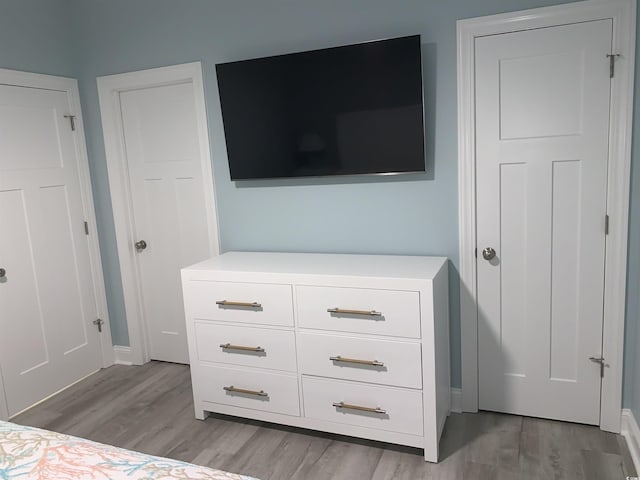 interior space featuring light wood-style floors and baseboards