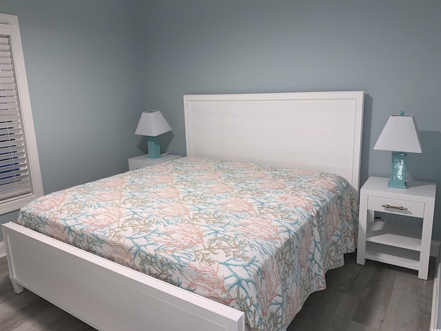 bedroom with wood finished floors