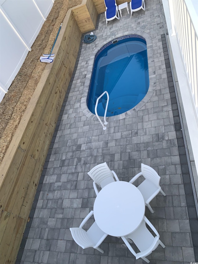 outdoor pool with a patio