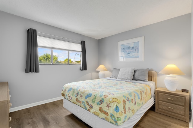 bedroom featuring dark hardwood / wood-style floors