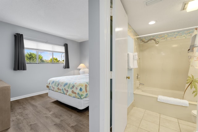 bedroom featuring light hardwood / wood-style floors