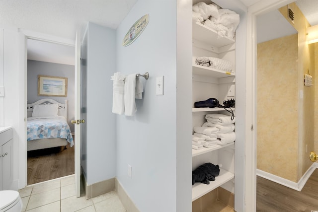 bathroom with tile patterned floors and vanity