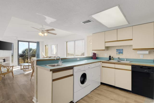 kitchen with kitchen peninsula, light wood-type flooring, black dishwasher, and sink